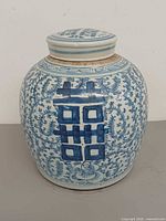 Front view showing double happiness motif and lid