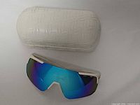 Sunglasses with white Oakley hard case