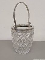 Front view showing crystal pattern, silver rim and handle up