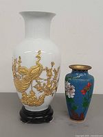 Front view of both vases showing size difference and main designs