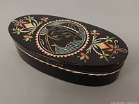 overall view of trinket box closed showing front and artwork