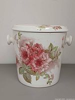 Front view of chamber pot showing Rose Bloom floral pattern and lid in place
