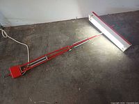 Lamp illuminated, articulating arm extended