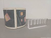 Cylinder vase and lucite bud vase side by side