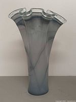 Front view of tall grey-blue Murano swirl glass vase with ruffled rim