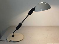 Lamp full view showing shade, arm, and base