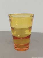 Front view of honey amber ribbed vase