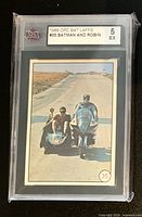 Front of KSA-slabbed card showing Batman and Robin motorcycle image and grading label 5 EX
