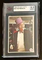 Front of slabbed trading card showing KSA label with grade 6.5 ENM+ and the card image