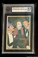Front view of graded card showing label and image of Penguin, Joker, Bruce Wayne