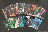 Front faces of assortment of Batman Forever trading cards