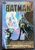Front cover showing Batman, Joker background, DC logo, title