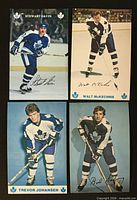 Front view of four Toronto Maple Leafs player postcards showing images and signatures