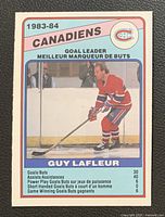 Front of Guy Lafleur O-Pee-Chee hockey card showing action image and goal leader text