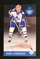 Front of postcard showing player image, signature and team logo