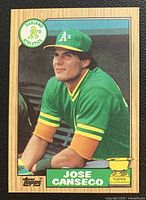 Front of Jose Canseco 1987 Topps card showing player image, team logo, card number and rookie trophy