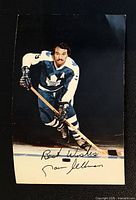 Front of postcard showing Norm Ullman in full uniform and printed autograph