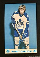 Front of postcard showing Randy Carlyle in full uniform with printed name and team graphics
