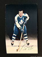 Front of postcard showing Ron Ellis in full uniform on ice