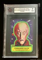 Front view of graded sticker card showing Commander Balok artwork and KSA grade label