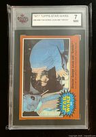 Front of KSA-slabbed 1977 Topps Star Wars #305 card showing image, orange border and grade label 7 NM