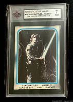 Front view of graded card showing image, caption and KSA grade label