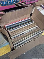 Box filled with upright 12-inch LPs showing spines