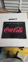 Front cover of hardcover book showing title and Coca-Cola logo