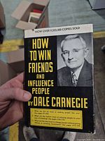 Front cover of How to Win Friends and Influence People showing title, author photo, sales blurb