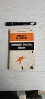 Front cover of Ideology in Conflict paperback with marker for scale