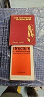 Front covers of both architecture books displayed on cutting mat