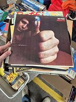 Stack of LP records with Don McLean “American Pie” cover visible on top