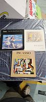 Front covers of all three Picasso catalogs