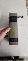 Spine showing title, publisher, cloth texture