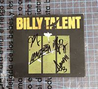 Front cover showing album artwork and signatures