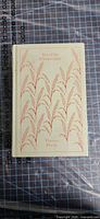 Front cover showing cloth wheat design and title