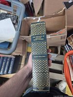 Spine view showing title, editor, decorative gilt pattern, publisher mark