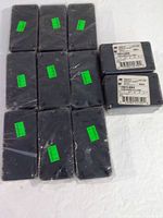 11 black plastic enclosure boxes, two with visible labels