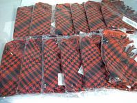 Overview of 12 packaged red and black neckerchiefs