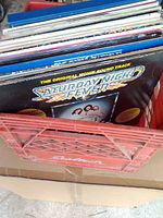 Top view of crate showing stack of LPs, front album Saturday Night Fever soundtrack