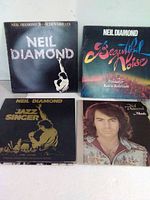Front covers of four Neil Diamond albums