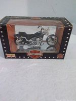 Front view of boxed Maisto Harley-Davidson die-cast motorcycle