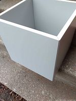 Front and side exterior of light grey IKEA Eket cube