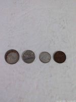 Four 1946 Canadian coins laid out in order of denomination