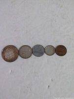 Front view of all five coins in size order