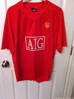 Front view showing AIG sponsor and club crest