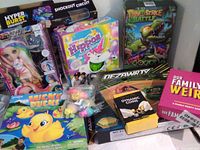 Group shot showing nine boxed toys and games