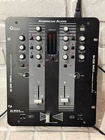 Front view of mixer showing controls, branding and LED meter