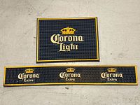 Front view of both mats showing logos and size difference