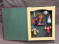 Open box displaying all seven ornaments in tray